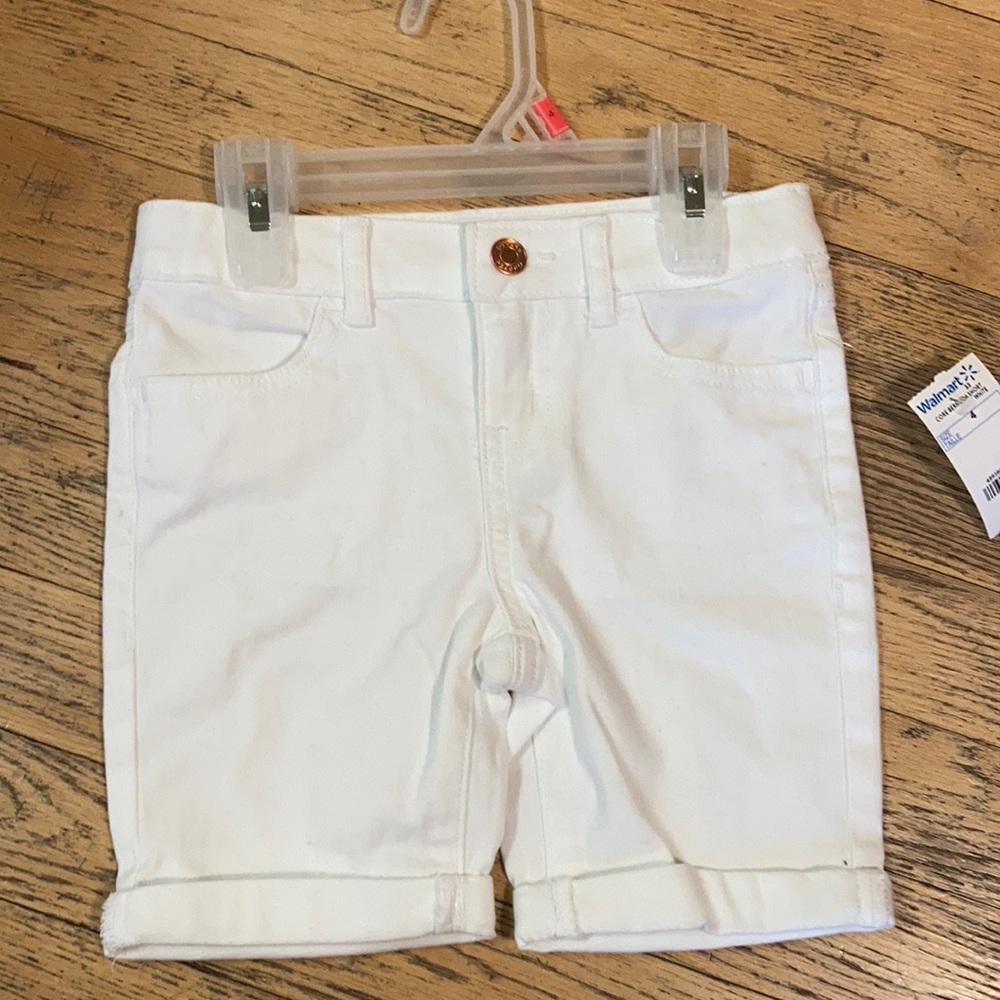 A pair of new white shorts